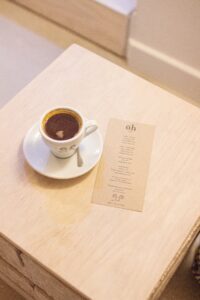 Jaunty Goat Coffee next to openhome menu on table